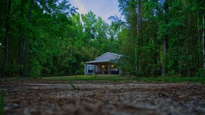 A small cabin surrounded by dense forest. - Secluded Retreat With hot tub ideal to fish and relax on private pond (Orangeburg)