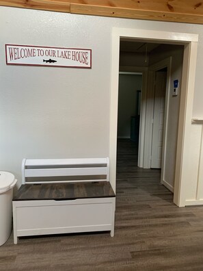 Enjoy a bright and airy space with a comfortable bench and convenient amenities.