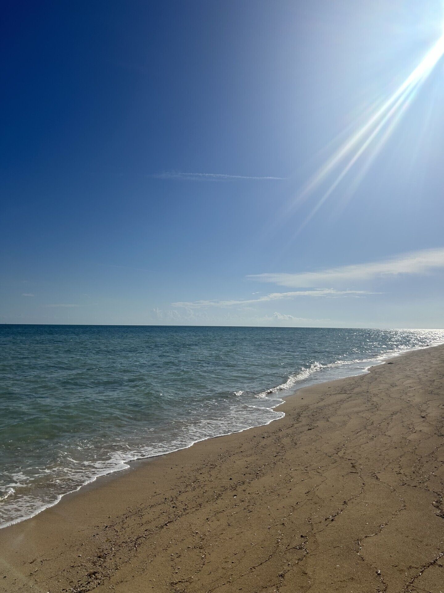 On the beach, sun loungers, beach towels