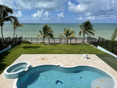 Blue Birds Beach House, right on the beach with a large backyard & heated pool.