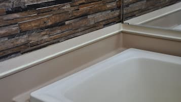 Shower, hair dryer, slippers, towels