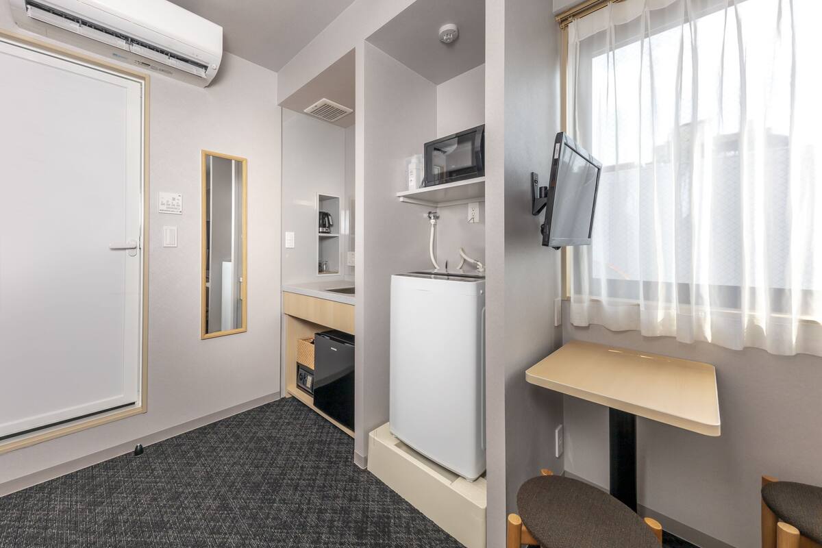 Chambre Double | Coin séjour