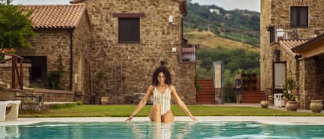 Seasonal outdoor pool, pool umbrellas, sun loungers