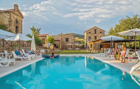 Seasonal outdoor pool, pool umbrellas, sun loungers