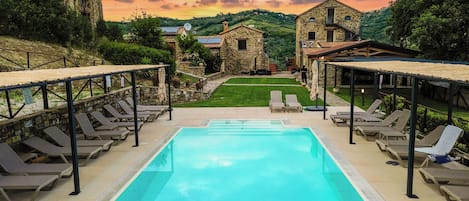 Seasonal outdoor pool, pool umbrellas, pool loungers