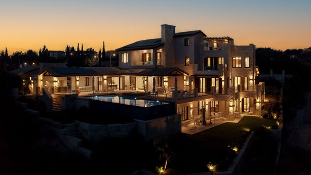 A multi-story house with a swimming pool, outdoor seating, and multiple balconies. - Villa Elea, New Deluxe Golf Villa in Aphrodite Hills - 6 Bedrooms, 7 Bathrooms.  (Kouklia)