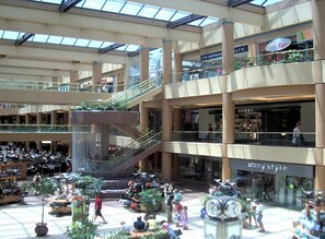 A multi-level shopping mall with various stores, including Gucci and Sony Style. - Old Town Scottsdale|Stylish New Condo| Heated Pool (Scottsdale)