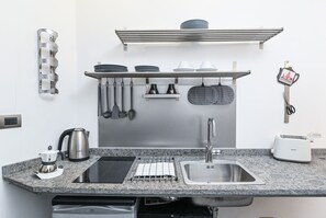Fridge, microwave, stovetop, coffee/tea maker