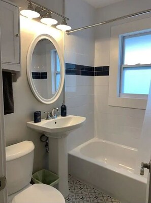 Combined shower/tub, hair dryer, towels, soap