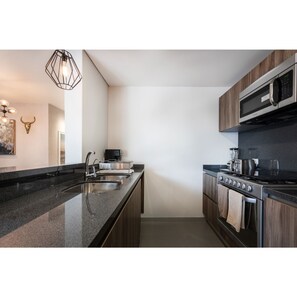 Deluxe Apartment | Private kitchen | Full-size fridge, microwave, oven, stovetop - Sophisticated Pad @Roma Norte & Condesa (Mexico City)