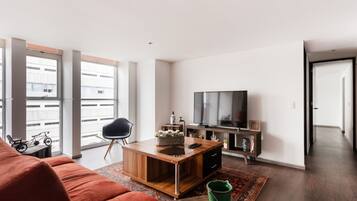 Departamento Deluxe | Sala de estar | Televisión