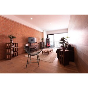 Departamento Deluxe | Área de sala de estar | Televisión