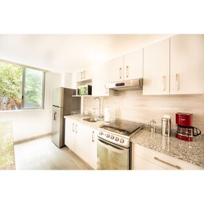 Deluxe Apartment, 2 Bedrooms | Private kitchen | Full-sized fridge, microwave, oven, stovetop