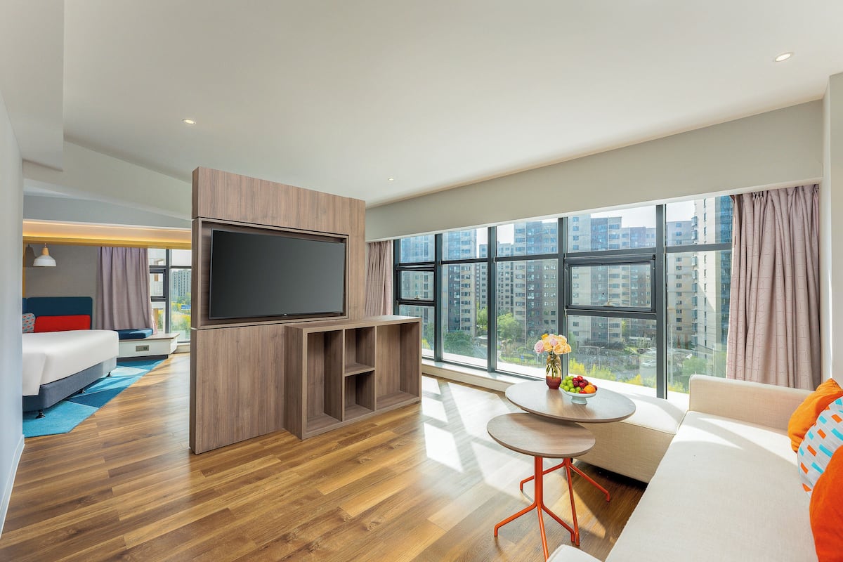 Suite, 1 King Bed | 1 bedroom, in-room safe, laptop workspace, blackout drapes