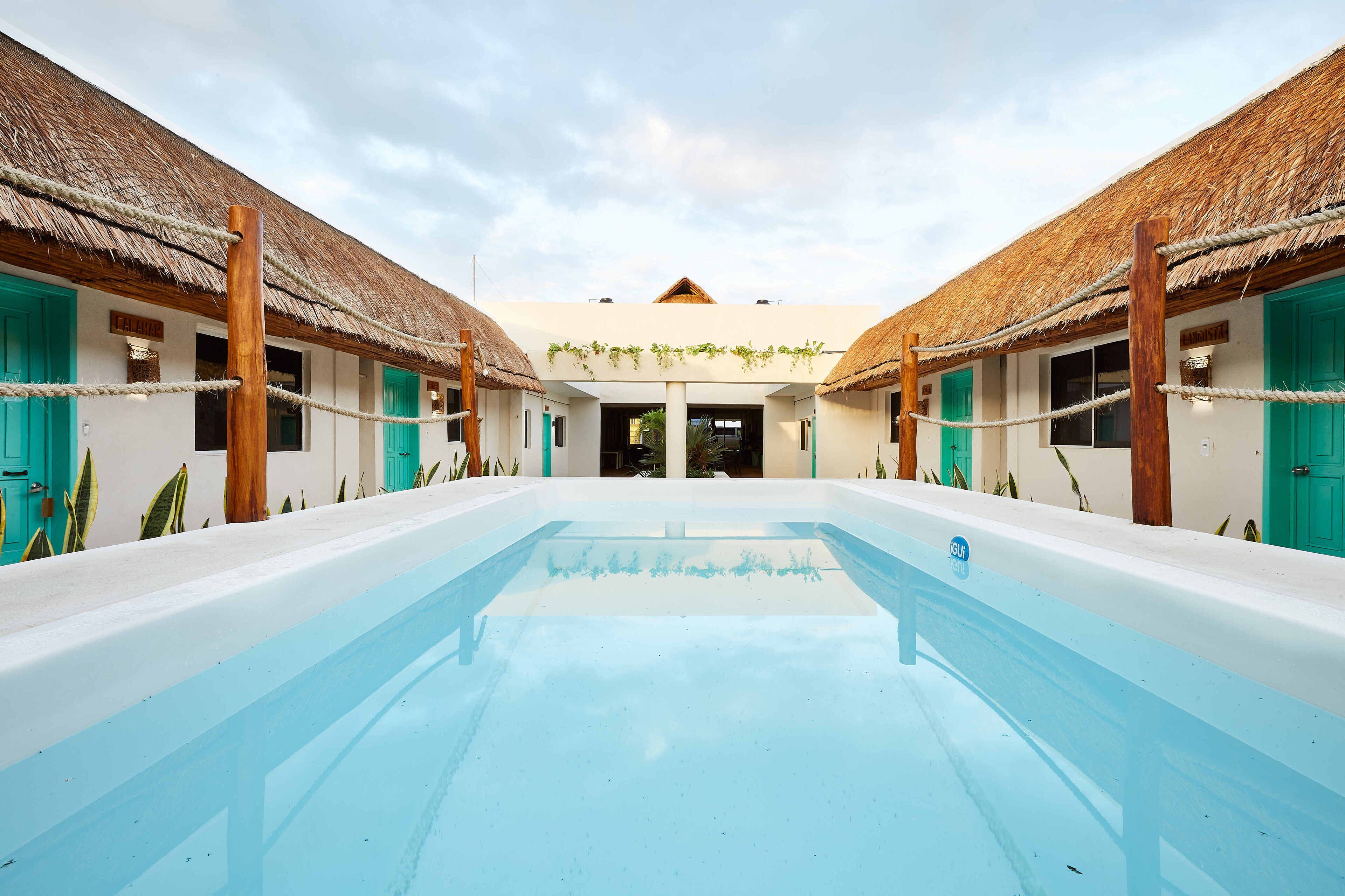 Outdoor pool, open 9:00 AM to 10:00 PM, pool loungers
