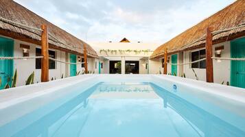 Outdoor pool, open 9:00 AM to 10:00 PM, pool loungers