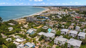 A coastal residential area with a beach, multiple-story buildings, and a mix of single and multi-family homes. - Casa Bella Vita | Walk to Crescent Beach, Semi-Private Heated Pool, & Four Balconies (Sarasota)