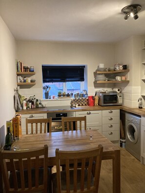 Fridge, dishwasher, dining tables