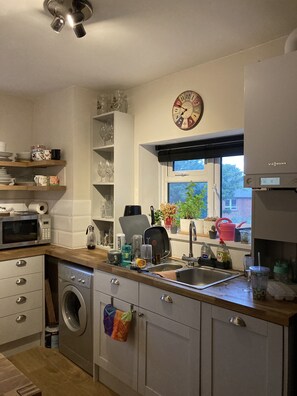 Fridge, dishwasher, dining tables