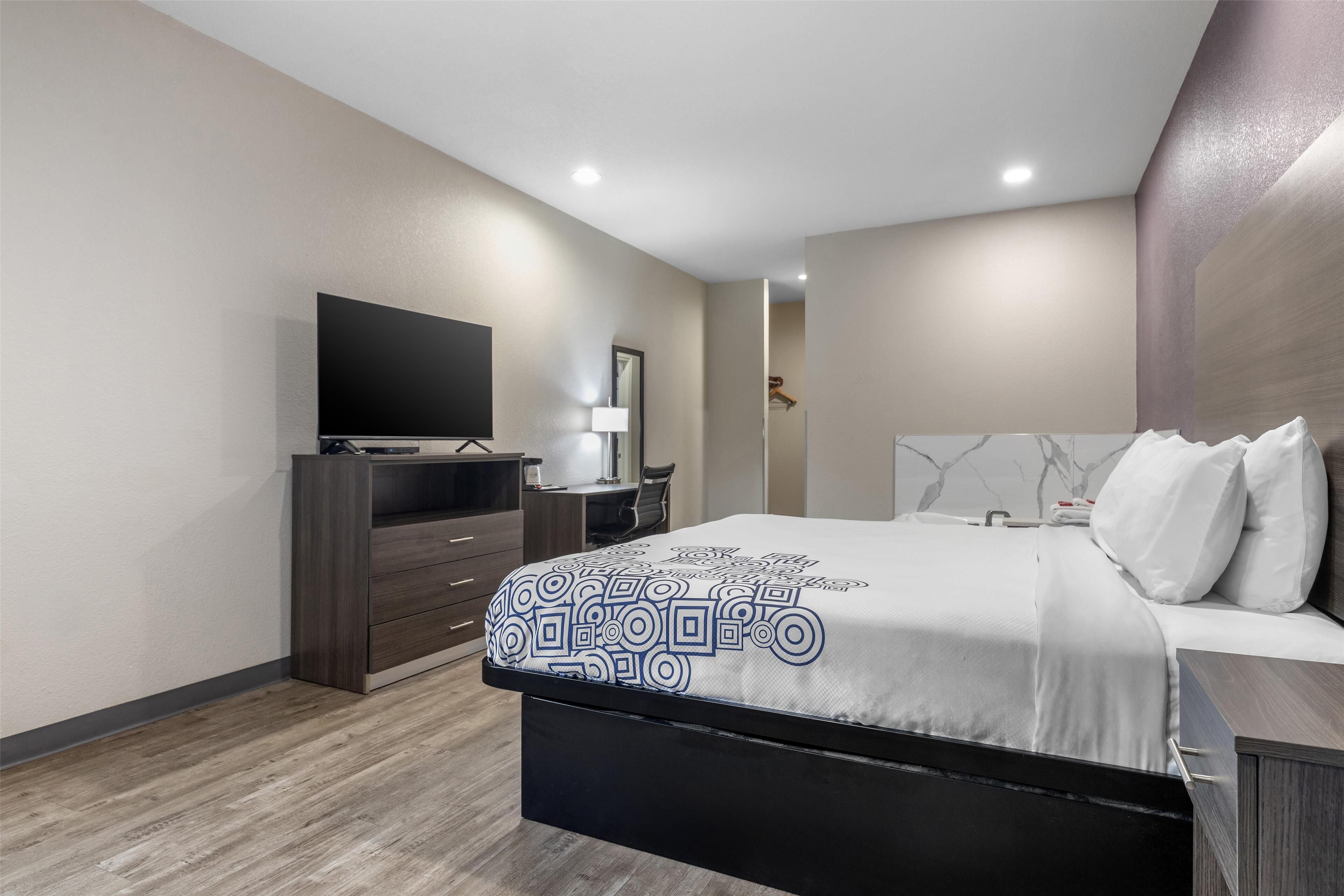 suite, 1 king bed, non smoking, jetted tub | 1 bedroom, desk, laptop workspace, blackout curtains