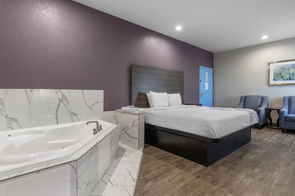 Suite, 1 King Bed, Non Smoking, Jetted Tub | Desk, laptop workspace, blackout drapes, soundproofing