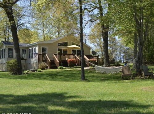 GO JUMP IN THE LAKE at this lovely waterfront home!