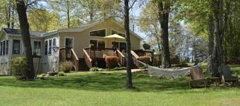 GO JUMP IN THE LAKE at this lovely waterfront home!