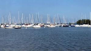 A marina with multiple sailboats docked in calm waters. - THE GROVE 6    10 MIN FROM THE BEACH In the heart of Coconut Grove and CocoWalk (Miami)