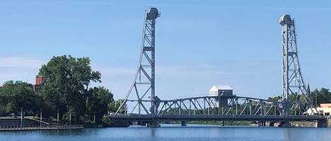 A bridge with two towers over a body of water.