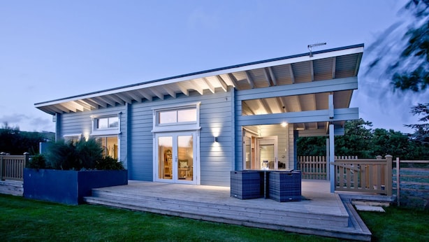 A modern two-story house with a covered porch, large windows, and a well-maintained lawn. - Cutterbrough, Great Field Lodges -  a lodge that sleeps 2 guests  in 1 bedroom (Braunton)
