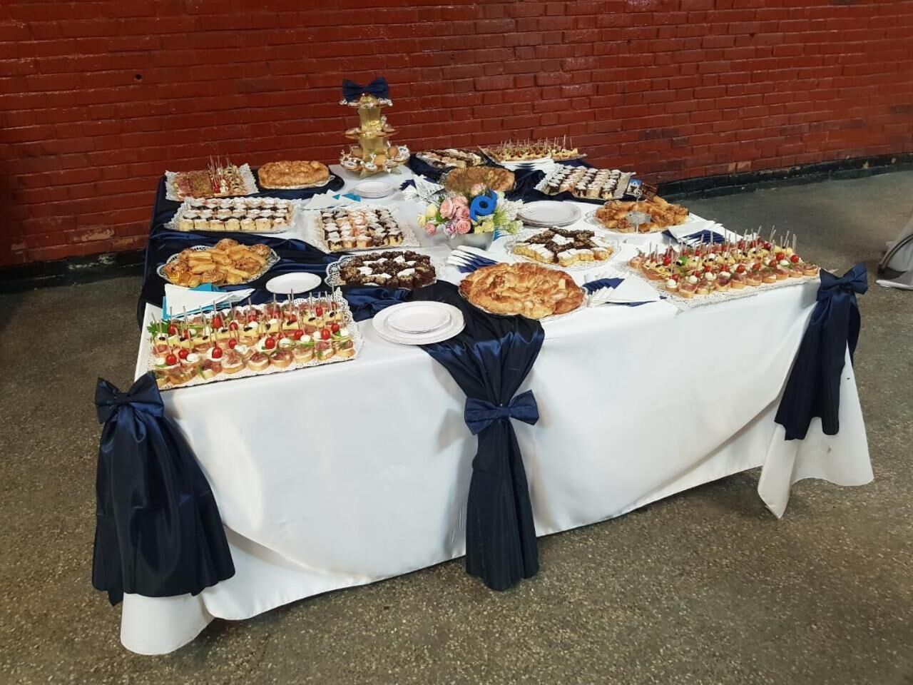 A table set up with various food items, likely for a gathering or event.
