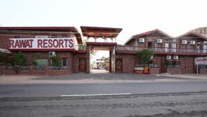 A building with a sign reading "RAWAT RESORTS". - Rawat Resorts (Tivari)