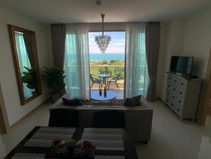 Luxury Condo | Living area | Flat-screen TV