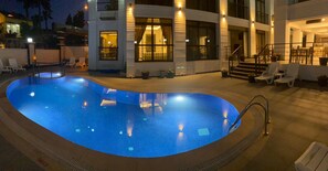 Outdoor pool, pool umbrellas, sun loungers
