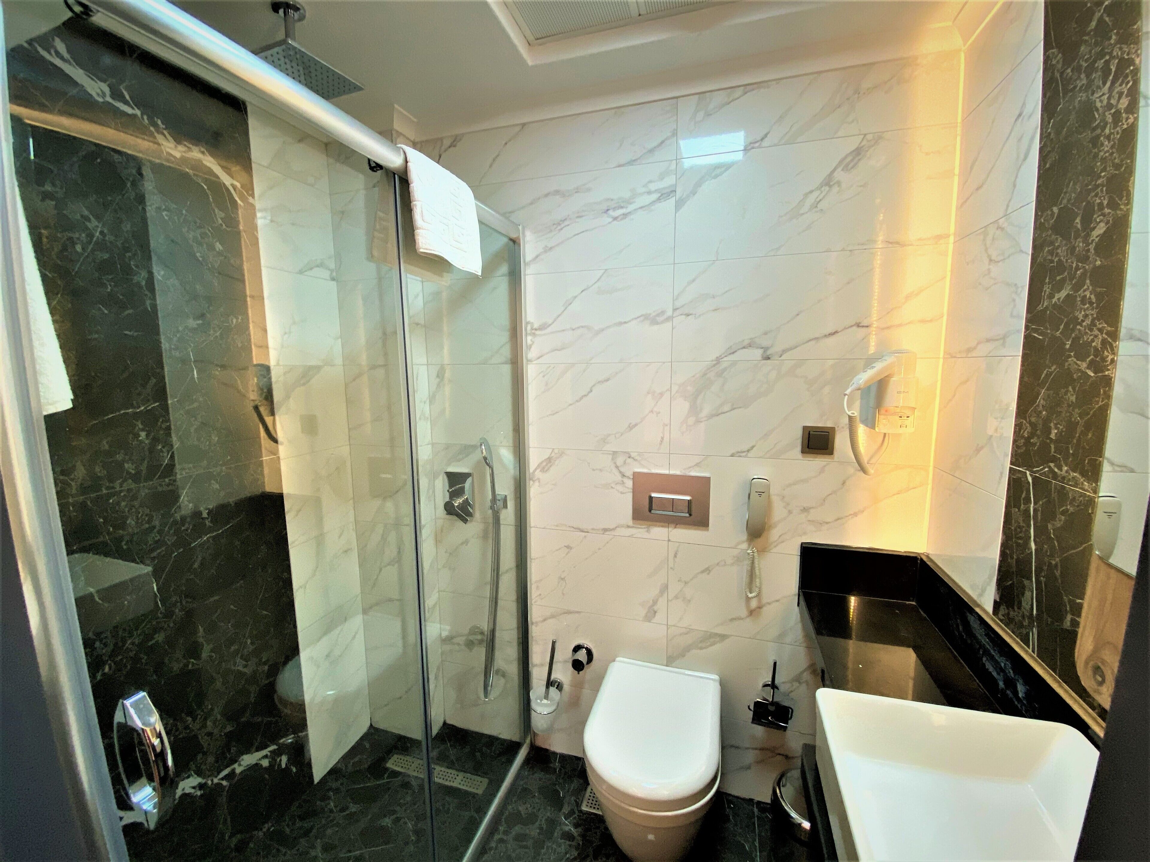 standard room | bathroom | shower, rainfall showerhead, designer toiletries, hair dryer