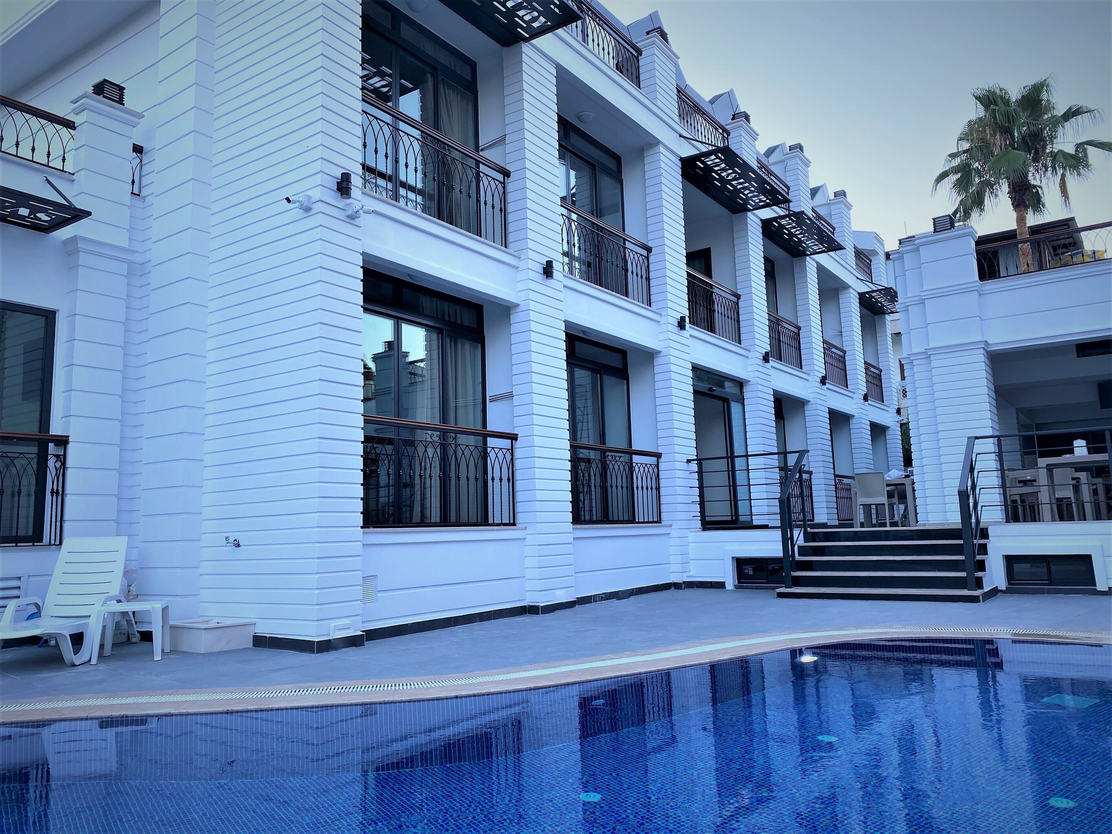 outdoor pool, pool umbrellas, pool loungers