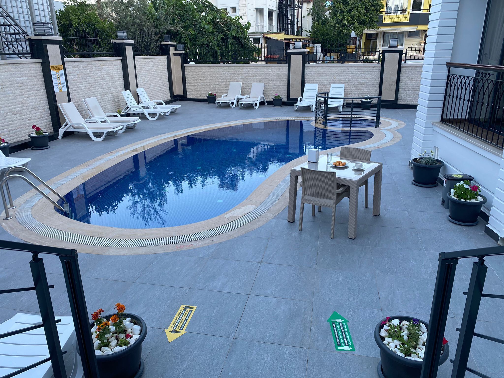 outdoor pool, pool umbrellas, pool loungers