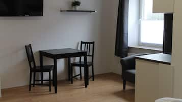 Double Room | Living area | 32-inch flat-screen TV with satellite channels, TV