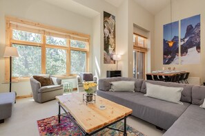 Relax in this inviting living space with a comfortable sofa, coffee table, and dining area.