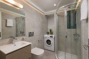 Shower, hair dryer, towels, soap