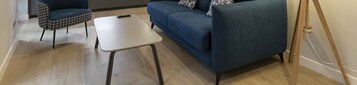 Luxury Apartment | Living area | 50-inch Smart TV with cable channels, TV