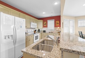 Dishwasher, coffee/tea maker, cookware/dishes/utensils, dining tables