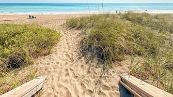 On the beach, sun loungers, beach towels