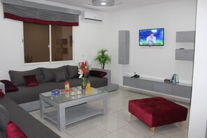 Basic Apartment | Living area | Smart TV - Residence Achomoukhe (Laayoune)