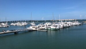 A marina with multiple boats docked at piers. - Ready to Rest and Relax at Vero Villa- Your Vacation Home Awaits. (Vero Beach)