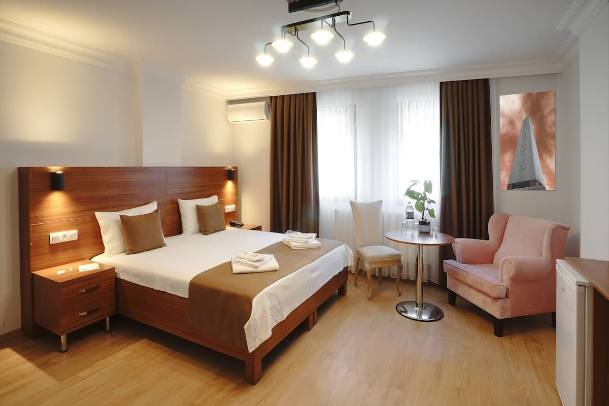 Habitación Deluxe con 1 cama matrimonial o 2 individuales | 1 habitación, sábanas italianas Frette y ropa de cama de alta calidad