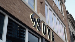 A building with a sign that reads "SOVA".