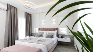 A modern bedroom with a large bed, a bedside table, a nightstand, and a large window with curtains.