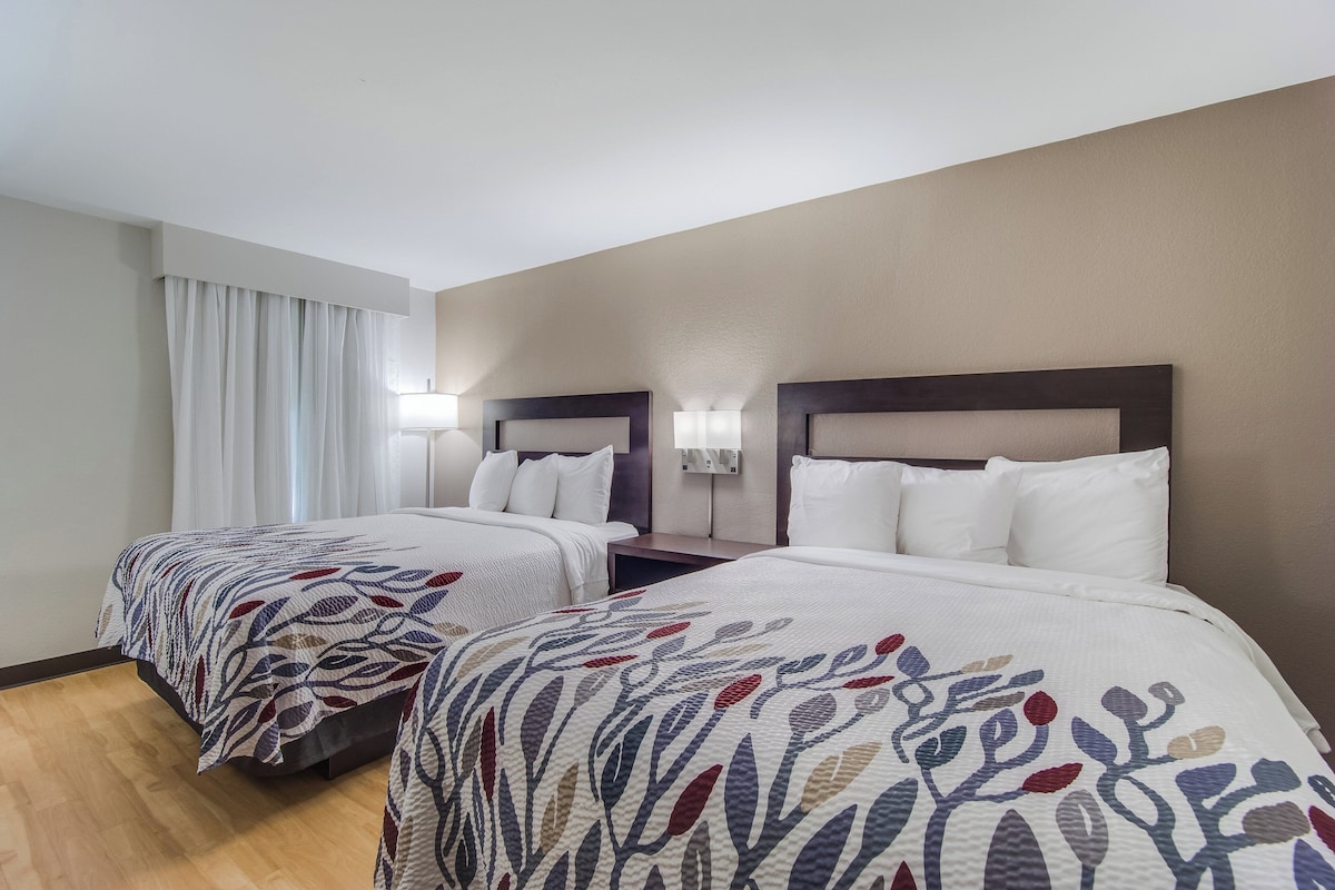 Deluxe Room, 2 Queen Beds, Non Smoking | Desk, laptop workspace, blackout drapes, iron/ironing board