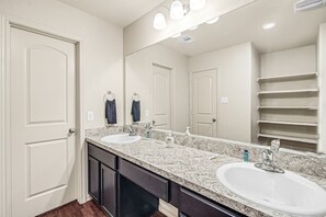 Combined shower/bathtub, hair dryer, towels, soap